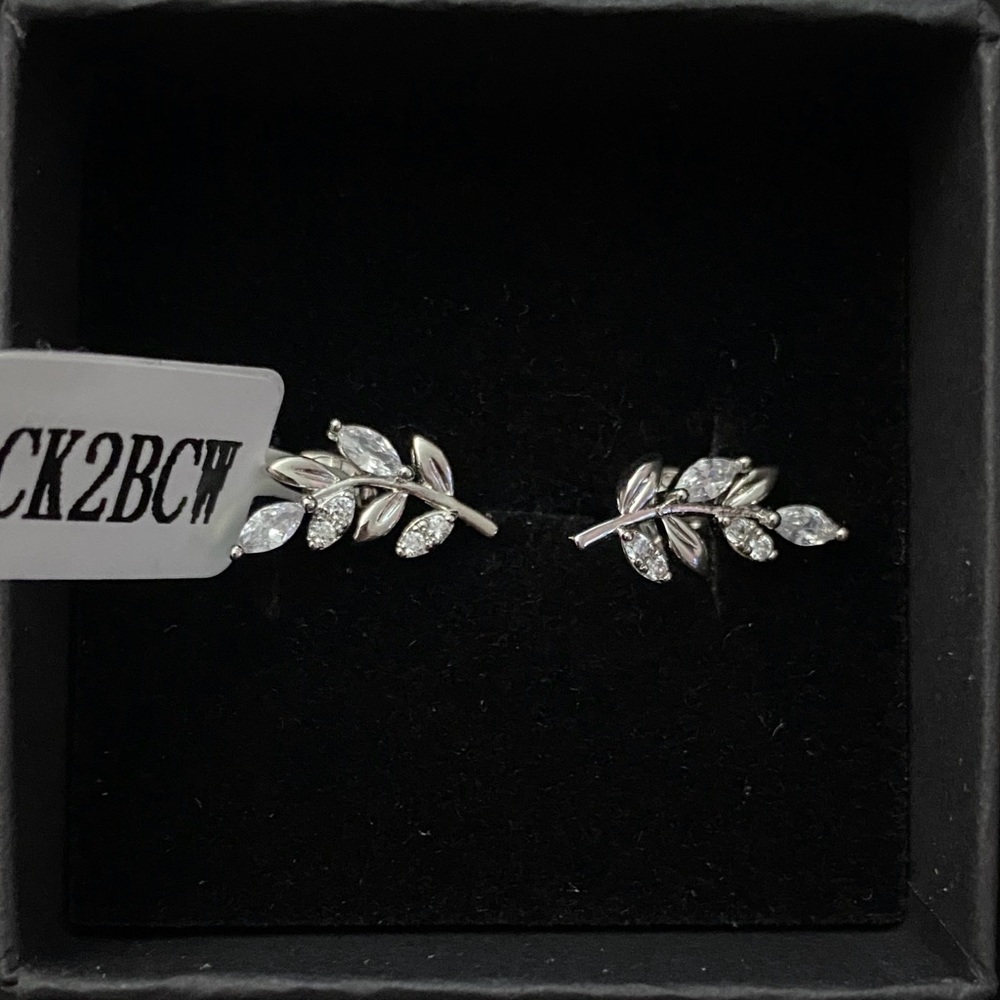 Charmed aroma silver leaf stud earrings. Brand new never worn.
